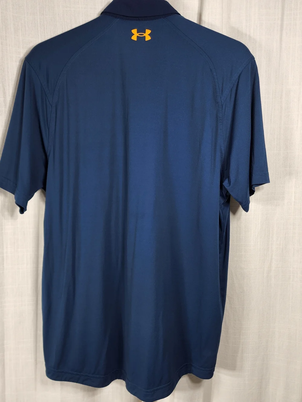 Under Armour Men's Navy Polo with Yellow Logo